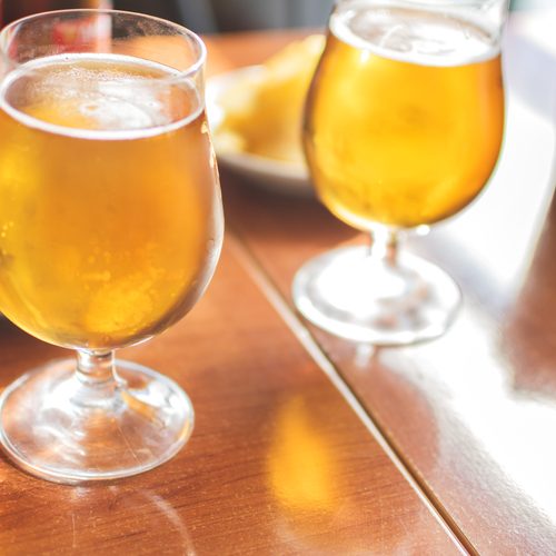 Cold beer glasses with delicious tapas to enjoy among friends.